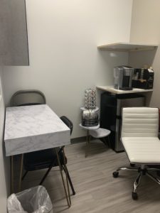 sherman oaks suite 1208 task room, white table, coffee machine