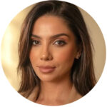 Sophie Grigoryan, AMFT, APCC. A woman with long brown hair and natural makeup is looking at the camera against a soft, neutral background.