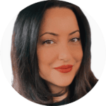 A woman with long dark hair and red lipstick smiles slightly, facing the camera in a close-up portrait.