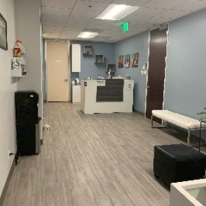 sherman oaks waiting room suite 1208 white reception desk, white bench